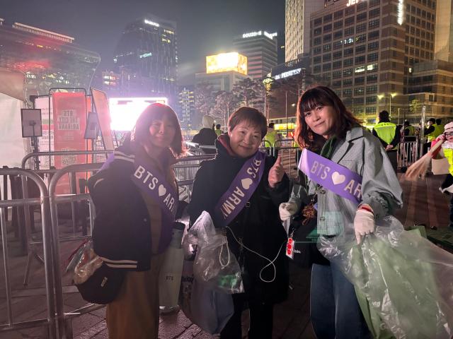 Fans clean up after the BTS concert ended on March 21 2026 Joongha Yoo