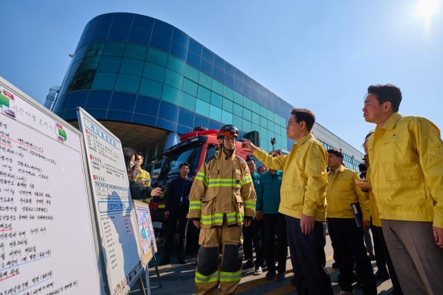 President Lee Jae Myung inspects the Daejon factory site where a fire killed 14 on March 21 2026 Provided by the presidential office