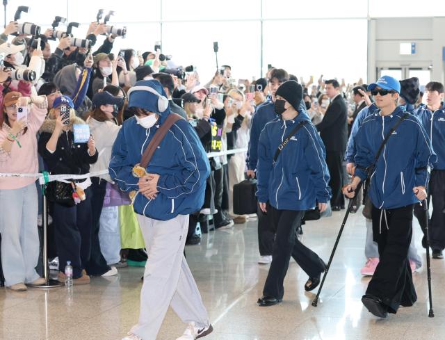 BTS flies to New York sporting Keep Swimming