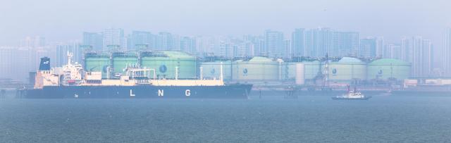 An LNG carrier and LNG storage tanks at Korea Gas Corporations Incheon LNG Terminal March 23 2026 Yonhap