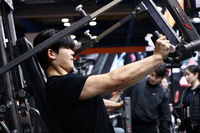 A visitors try out exercise equipment at SPOEX 2026 at COEX in Samseong-dong Gangnam-gu Seoul March 26 2026 AJP Han Jun-gu