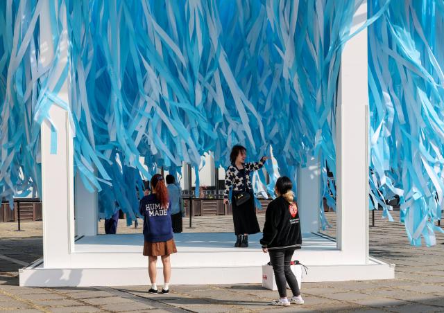 Visitors look at the “BTS Sound Cube” installed at the courtyard of MMCA Seoul in Jongno District Seoul on March 26 AJP Yoo Na-hyun 20260326