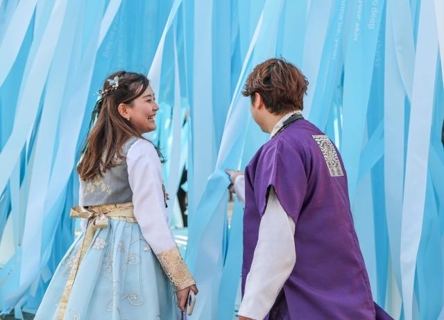 Visitors look at the “BTS Sound Cube” installed at the courtyard of MMCA Seoul in Jongno District Seoul on March 26 AJP Yoo Na-hyun 20260326