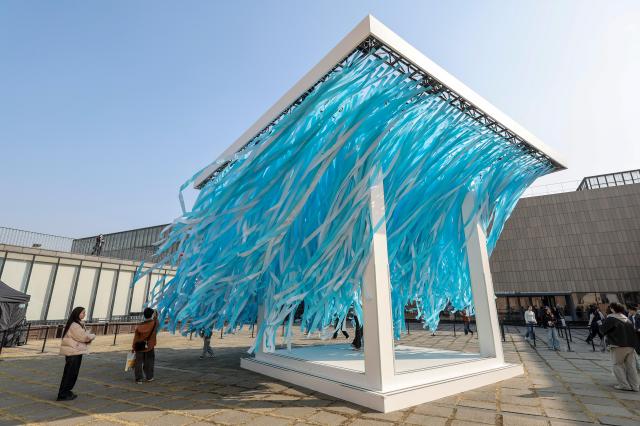 A “BTS Sound Cube” installation is set up at the courtyard of MMCA Seoul in Jongno District Seoul on March 26 Lyrics from “SWIM” are written on each blue ribbon AJP Yoo Na-hyun