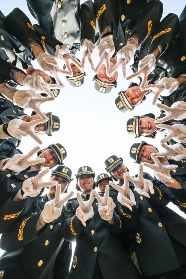 Newly commissioned non-commissioned officers NCOs pose for a commemorative photo during a commissioning ceremony for the ROK Army’s 26-1st class at the Army Non-Commissioned Officer Academy in Iksan North Jeolla Province on March 26 2026 Yonhap 20260326