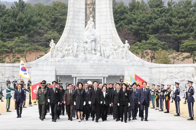 Lee Jae-myung the president moves after laying flowers during the West Sea Defense Day ceremony at the Daejeon National Cemetery on March 27 2026 Yonhap