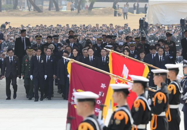 Lee Jae Myung the president walks to lay flowers during the West Sea Defense Day ceremony at the Daejeon National Cemetery March 27 2026 Yonhap
