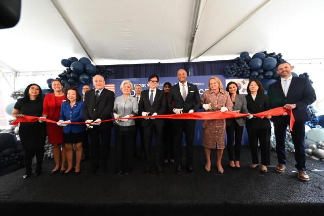 Ribbon-cutting ceremony at an event marking Samsung Biologics acquisition of manufacturing site in Rockville Maryland on March 31 2026 local time CEO John Rim in the center and to his right Korean Ambassador to US Kang Kyung-wha and left Gov Wes Moore Courtesy of Samsung Biologics