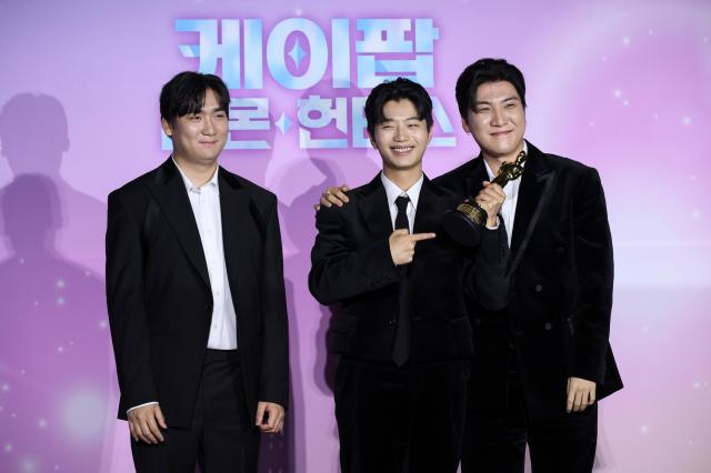 IDO poses during a press conference celebrating the Academy Award win of the Netflix film K-Pop Demon Hunters at CGV I’Park Mall in Yongsan Seoul on April 1 2026 From left composers Nam Hee-dong Lee Yoo-han and Kwak Joong-kyu AJP Yoo Na-hyun 20260401