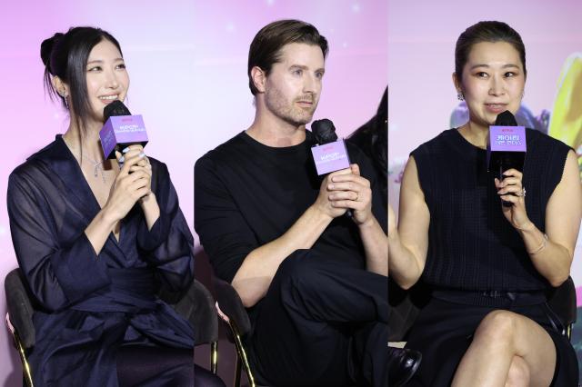 Attendees speak during a press conference celebrating the Academy Award win of the Netflix film K-Pop Demon Hunters at CGV Yongsan I’Park Mall in Seoul on April 1 2026 From left singer-songwriter Lee Jae director Chris Appelhans and director Maggie Kang 20260401