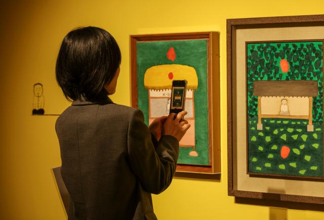Visitors view works at the Kim Sang-yu centennial exhibition “Unworn” at the Seoul Museum in Jongno District Seoul March 31 2026 AJP Yoo Na-hyun
