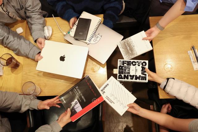 Participants gather for an “Admin Night” session at a café in Gwanak District Seoul March 31 2026 AJP Yoo Na-hyun