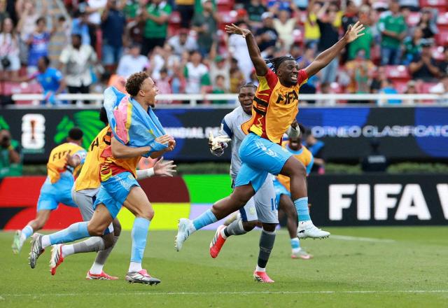 DR Congo players celebrate after clinching a place in the World Cup finals. [Yonhap/Reuters]