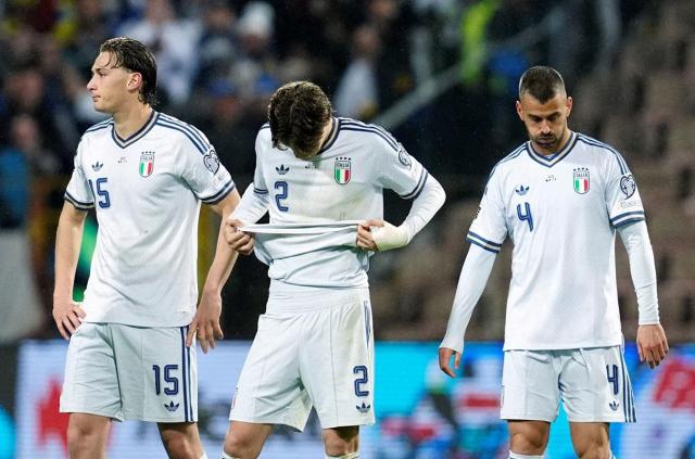 Italy players react after failing to qualify for the World Cup finals. [Yonhap/Reuters]