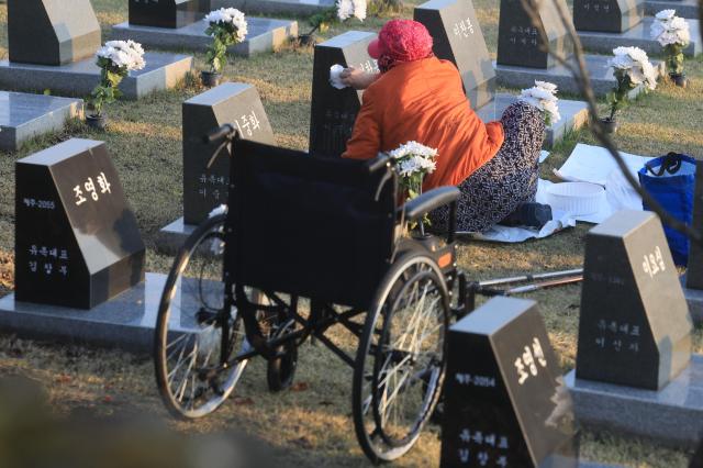 A bereaved family member pays respects to victims at a memorial stone for the missing at Jeju 4·3 Peace Park in Bonggae-dong Jeju City on the 78th anniversary of the Jeju April 3 Incident April 3 2026 Yonhap