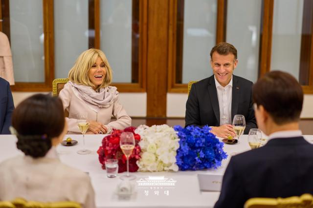 French President Emmanuel Macron and his wife attend a private dinner hosted by President Lee Jae Myung at the Blue House in Seoul on April 2 2026 Courtesy of the Blue House