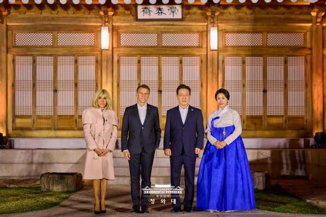 President Lee Jae Myung and his wife Kim Hye-kyung pose with French President Emmanuel Macron and his wife Brigitte Macron at Sangchunjae at the Blue House in Seoul on April 2 2026 Courtesy of the Blue House