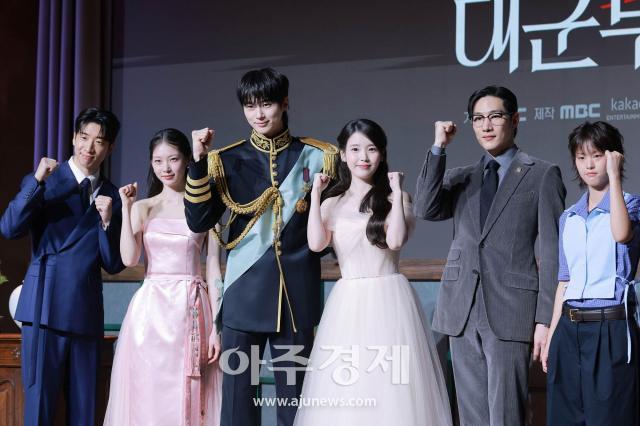 Cast members pose at the production presentation for MBC’s new Friday-Saturday drama ‘21st Century Grand Prince’s Wife’ at Josun Palace Seoul Gangnam in Seoul’s Gangnam district, April 6, 2026. From left: Yoo Su-bin, Gong Seung-yeon, Byeon Woo-seok, IU, Noh Sang-hyun and Lee Yeon.