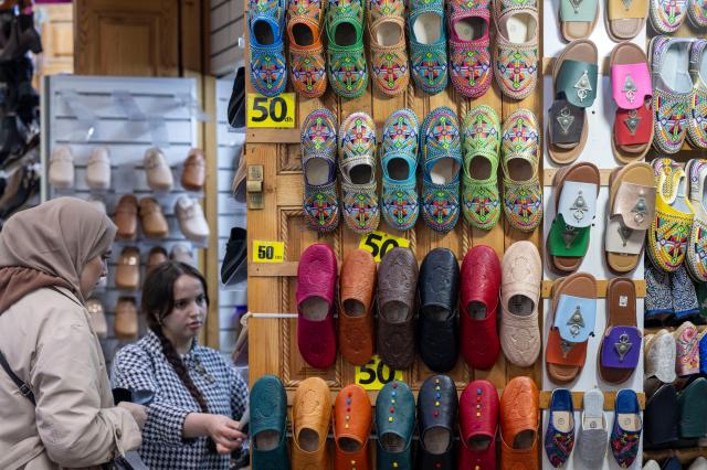 Moroccans buy shoes ahead of the Eid al-Fitr celebrations in Rabat Morocco 18 March 2026 Eid al-Fitr is an Islamic holiday that marks the end of the Muslim month of Ramadan and is celebrated during the first three days of Shawwal the 10th month of the Islamic calendar EPA-Yonhap 
