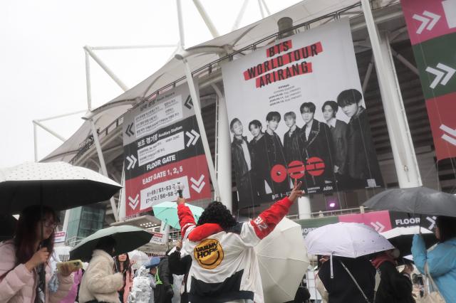 An ARMY poses for a photo before attending BTS WORLD TOUR ARIRANG IN GOYANG at Goyang Sports Complex in Ilsanseo-gu Goyang Gyeonggi Province April 9 2026 AJP Han Jun-gu
