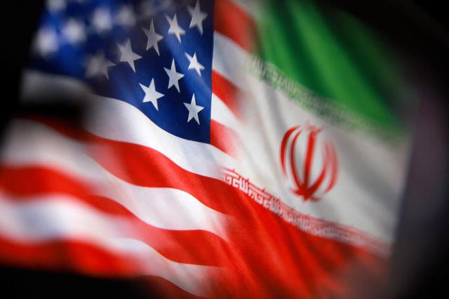US and Iranian flags are seen in this illustration taken March 23 2026 Reuters-Yonhap