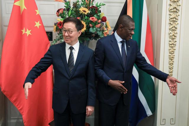 Chinese Vice President Han Zheng and South Africas Deputy President Paul Mashatile react after their bi-national meeting in Cape Town South Africa March 26 2026 Reuters-Yonhap 