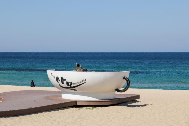 A coffee cup sculpture stands at Anmok Beach in Gangneung Gangwon Province on April 8 2026 AJP Yoo Na-hyun 20260408
