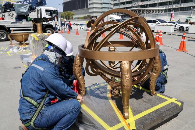 Officials from the Seoul Metropolitan Government clean the armillary sphere sculpture at Gwanghwamun Square in central Seoul on April 132026 AJP Yoo Na-hyun 20260413