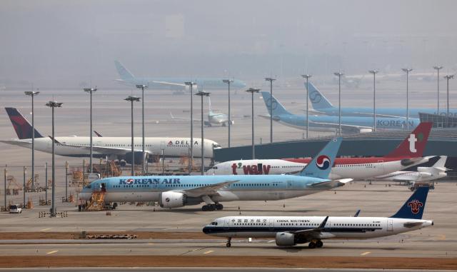 Aircraft are lined up on the tarmac at Incheon International Airport on Monday March 16 2026 Yonhap