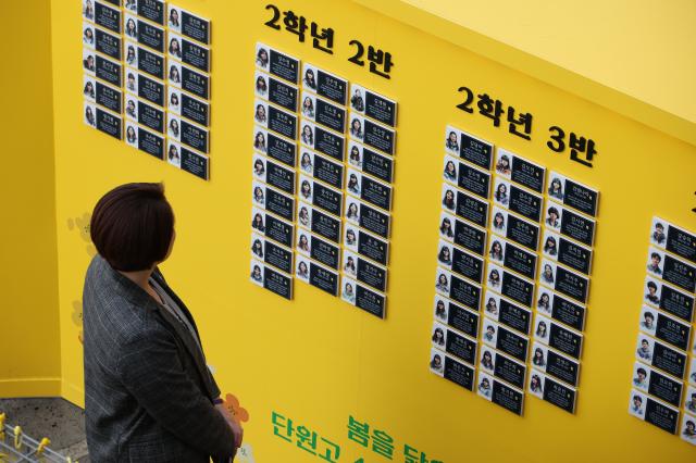 A citizen views photos of victims at the Memorial Classroom of the 416 Life and Safety Education Center in Ansan Gyeonggi Province April 15 AJP Han Jun-gu