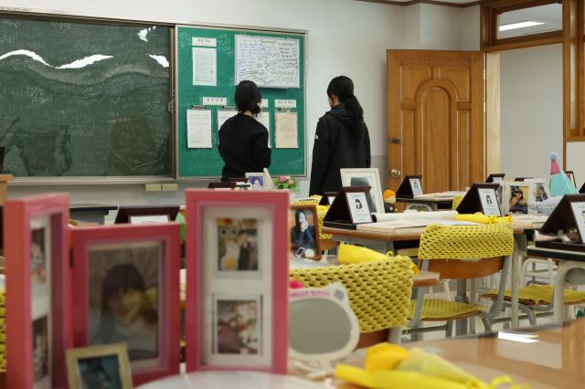 Citizens read school notices posted next to the blackboard at the Memorial Classroom of the 416 Life and Safety Education Center in Ansan Gyeonggi Province April 15 AJP Han Jun-gu