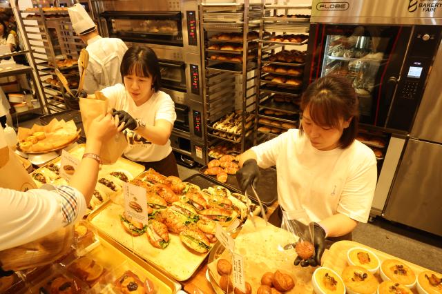 Booth staff sell bread products at the 2026 Korea International Bakery Fair held at COEX in southern Seoul on April 17 2026 AJP Han Jun-gu