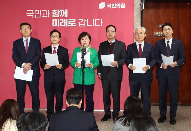 Cho Bae-sook third from left chair of the People Power Party’s Special Committee on Judicial Justice Protection and Anti-Dictatorship delivers a statement condemning alleged coercion and forced testimony by a special prosecutor at the National Assembly on April 10 2026 Yonhap 