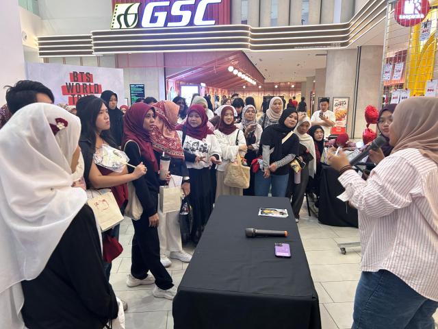 Malaysian Fans of Korean Kpop group BTS attend special live screening of the BTS Arirang world tour in Kuala Lumpur Saturday April 11 2026 AP-Yonhap