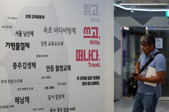 Visitors view the “Text-Hip x Local Travel” exhibition at HiKR Ground in central Seoul on April 23 2026 AJP Yoo Na-hyun20260423
