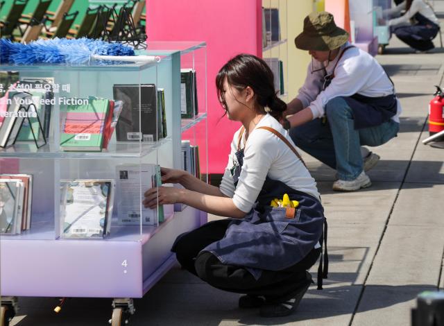 Officials prepare for the opening of the “Gwanghwamun Book Yard” outdoor library at Gwanghwamun Square in Seoul on April 23 2026 marking World Book and Copyright Day AJP Yoo Na-hyun