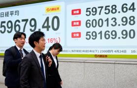 Nikkei briefly tops 60,000 for first time, then falls on profit-taking and oil worries