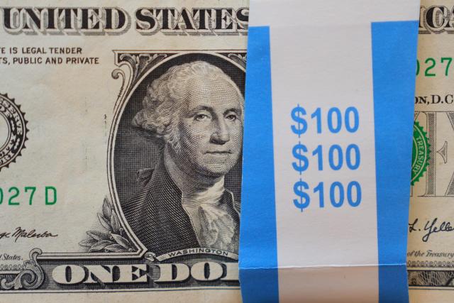 A portrait of George Washington is displayed on a stack of US one-dollar bills in Dallas Tuesday April 7 2026 AP-Yonhap 