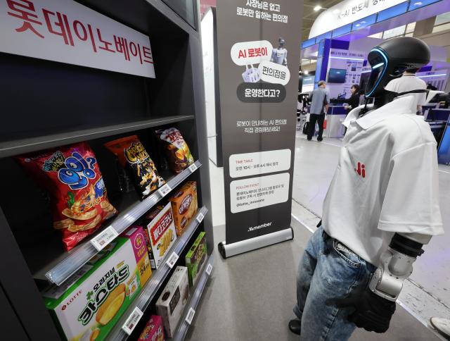 An AI convenience store robot is being demonstrated at a booth during World IT Show 2026 at COEX in Gangnam-gu Seoul on April 22 2026