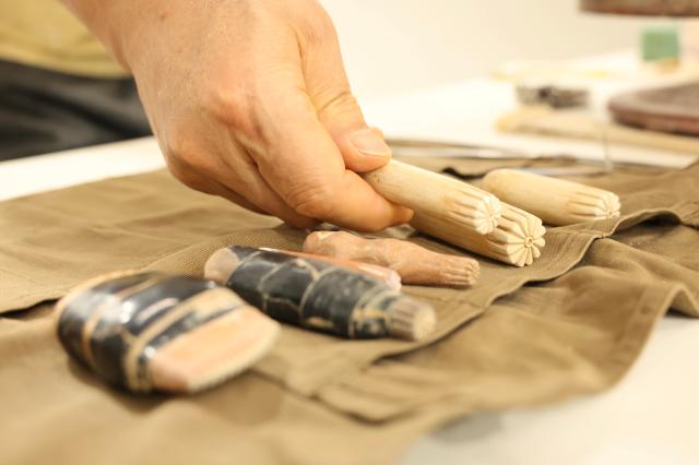 Master craftsman Yoo Yong-chul explains ceramic stamps used for carving patterns on ceramics at the Icheon Ceramic Festival held in Sindun-myeon Icheon April 29 2026 AJP Han Jun-gu