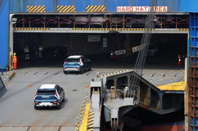 KIA vehicles for export are loaded onto a Hyundai Glovis car carrier bound for Tacoma in the western United States on April 3 2026 Reuters-Yonhap