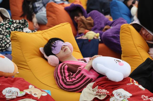 Participants sleep at the 2026 Han River Napping Championship held at Mulbit Plaza in Yeouido Hangang Park Yeongdeungpo-gu Seoul May 2 2026 AJP Han Jun-gu