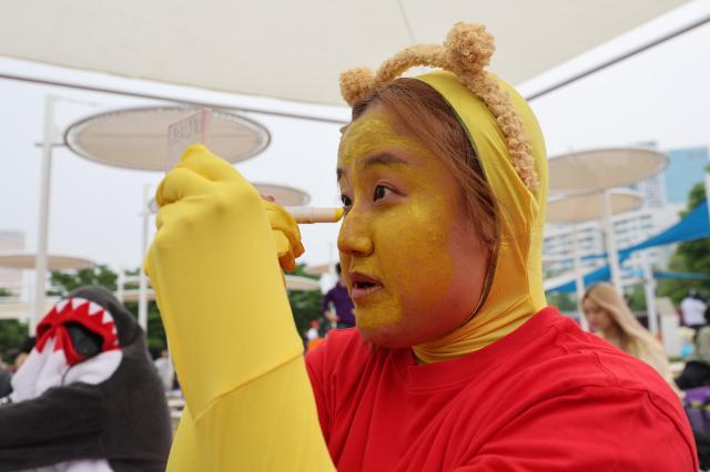 A participant wears a costume for the Best Dresser award at the 2026 Han River Napping Championship held at Mulbit Plaza in Yeouido Hangang Park Yeongdeungpo-gu Seoul May 2 2026 AJP Han Jun-gu