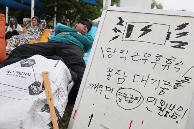 A participant sleeps at the 2026 Han River Napping Championship held at Mulbit Plaza in Yeouido Hangang Park Yeongdeungpo-gu Seoul May 2 2026 AJP Han Jun-gu