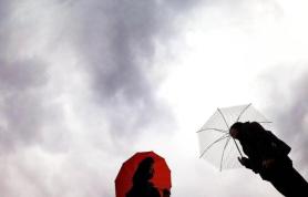Rain and Strong Winds to Linger Into Morning, Then Clear Gradually