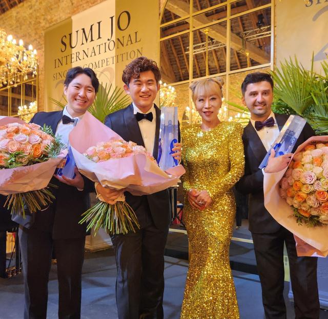 Winners of the inaugural Sumi Jo International Singing Competition pose for a commemorative photo with soprano Sumi Jo at Château de la Ferté-Imbault in France’s Loire Valley on July 12 2024 Yonhap