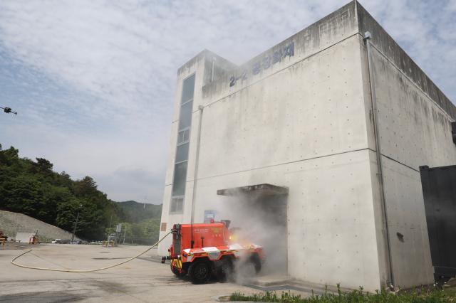 Unmanned firefighting robot FIRO moves for a life search demonstration at the unmanned firefighting robot naming ceremony and demonstration held at Gyeonggi Fire Service Academy in Yongin Gyeonggi Province May 7 2026 AJP Han Jun-gu