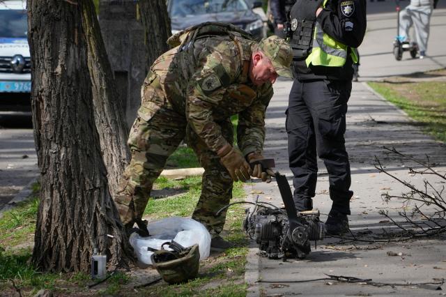 A serviceman inspects the wreckage of a Russian drone that fell in Kyiv Ukraine in this file photo AP-Yonhap