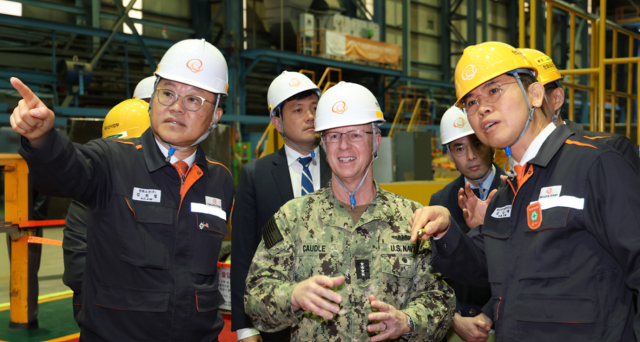 US Chief of Naval Operations Adm Daryl Caudle tours Hanwha Ocean’s Geoje shipyard in South Gyeongsang Province on Nov 15 2025 accompanied by Kevin Kim acting US ambassador to Korea Caudle inspected the shipyard’s assembly facilities and naval vessel quay including the USNS Charles Drew a US Navy dry cargo and ammunition ship undergoing maintenance repair and overhaul work at the yard Courtesy of Hanwha Ocean