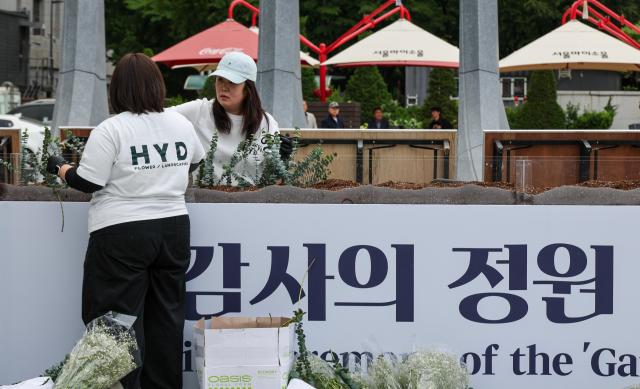 Officials prepare for the opening ceremony of the “Garden of Gratitude” at Gwanghwamun Square in Seoul on May 11 2026 ahead of its scheduled completion ceremony on May 12 AJP Yoo Na-hyun
